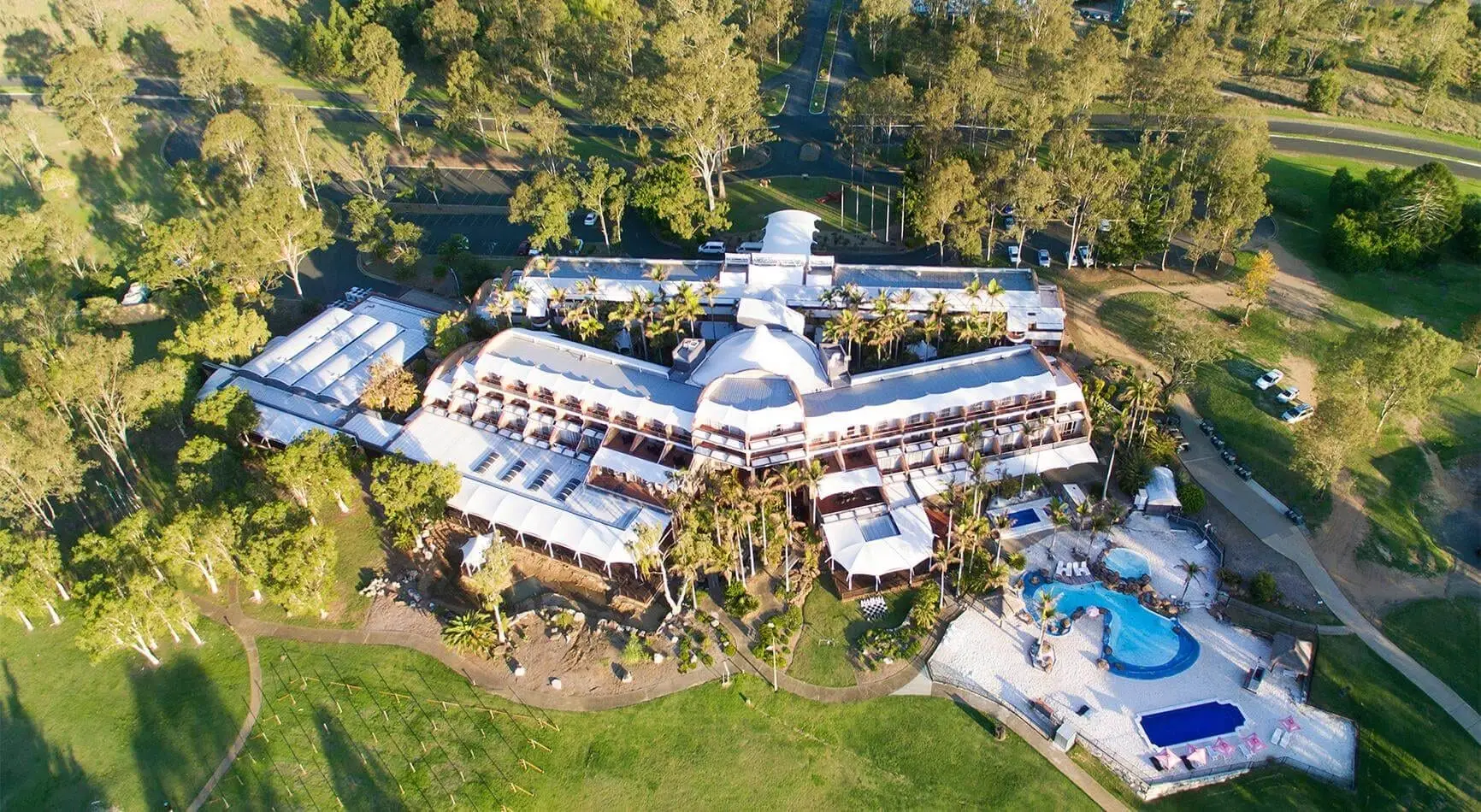 Aerial view of the resort buildings, pool and grounds