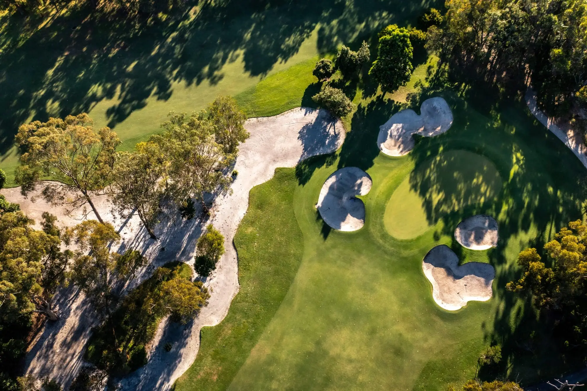 Aerial view of a green surrounded by sand bunkers