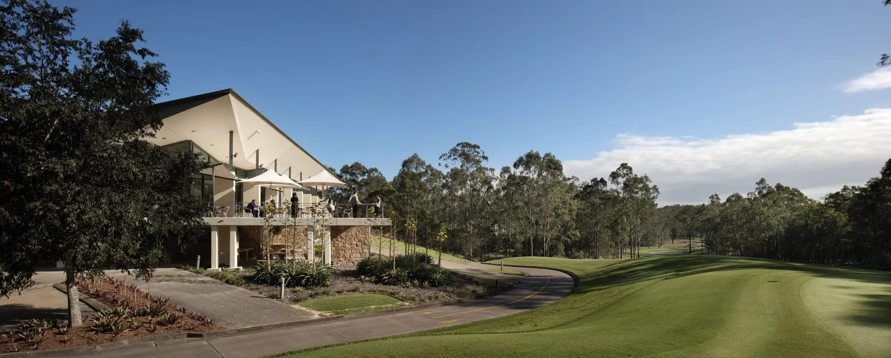 Clubhouse beside the fairway with eucalypt trees behind