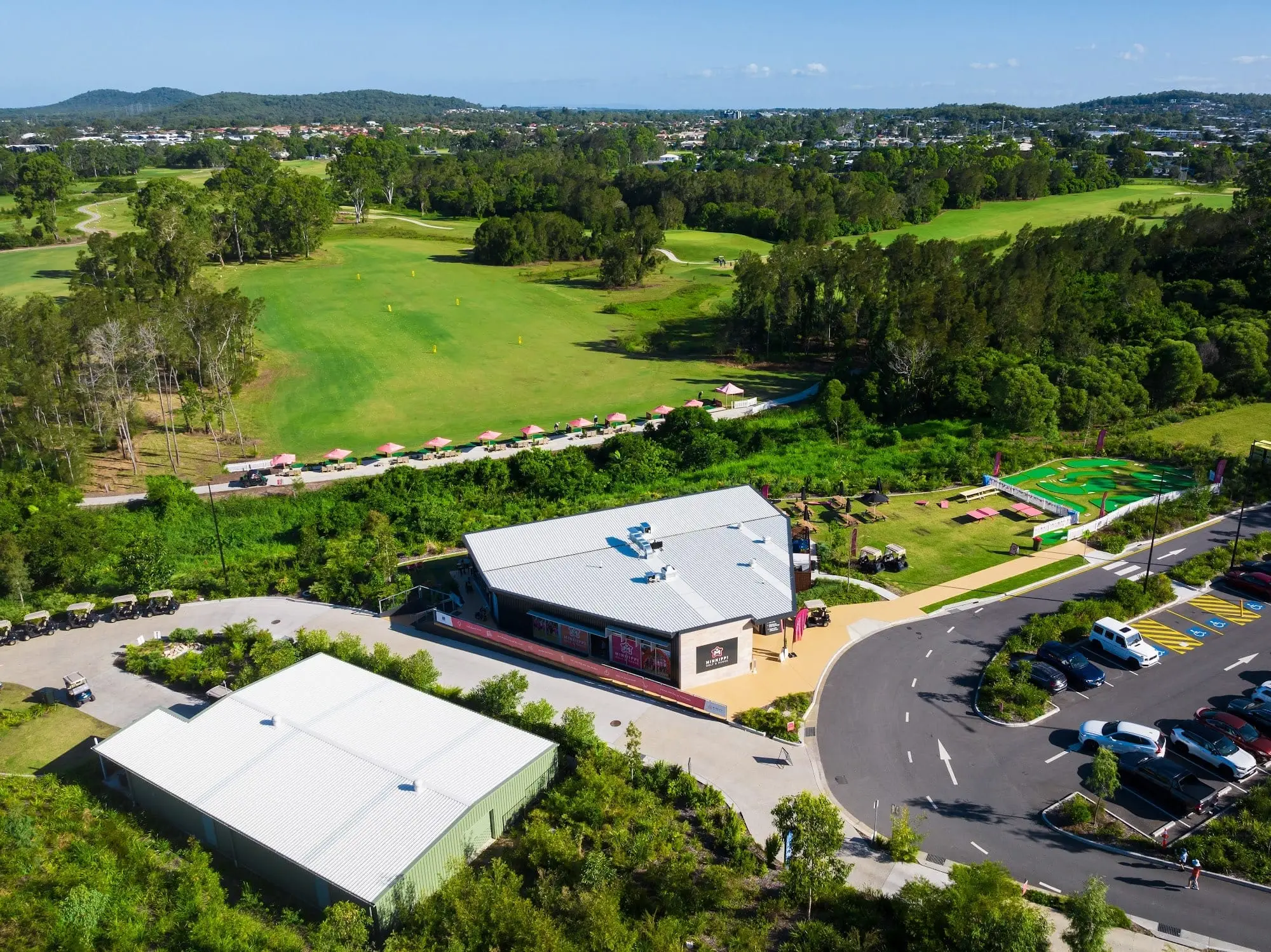 Aerial view of clubhouse, car park and fairway