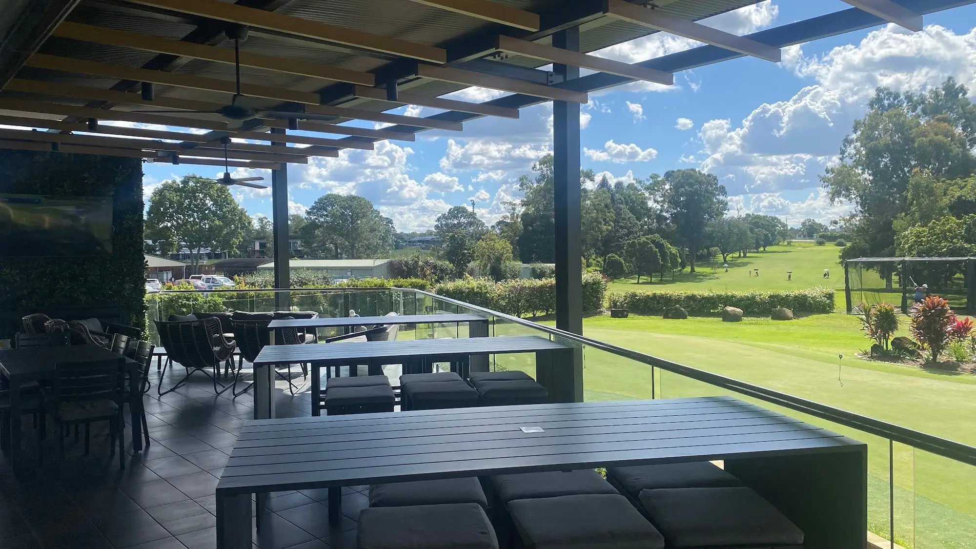 Covered terrace overlooking the course and practice green