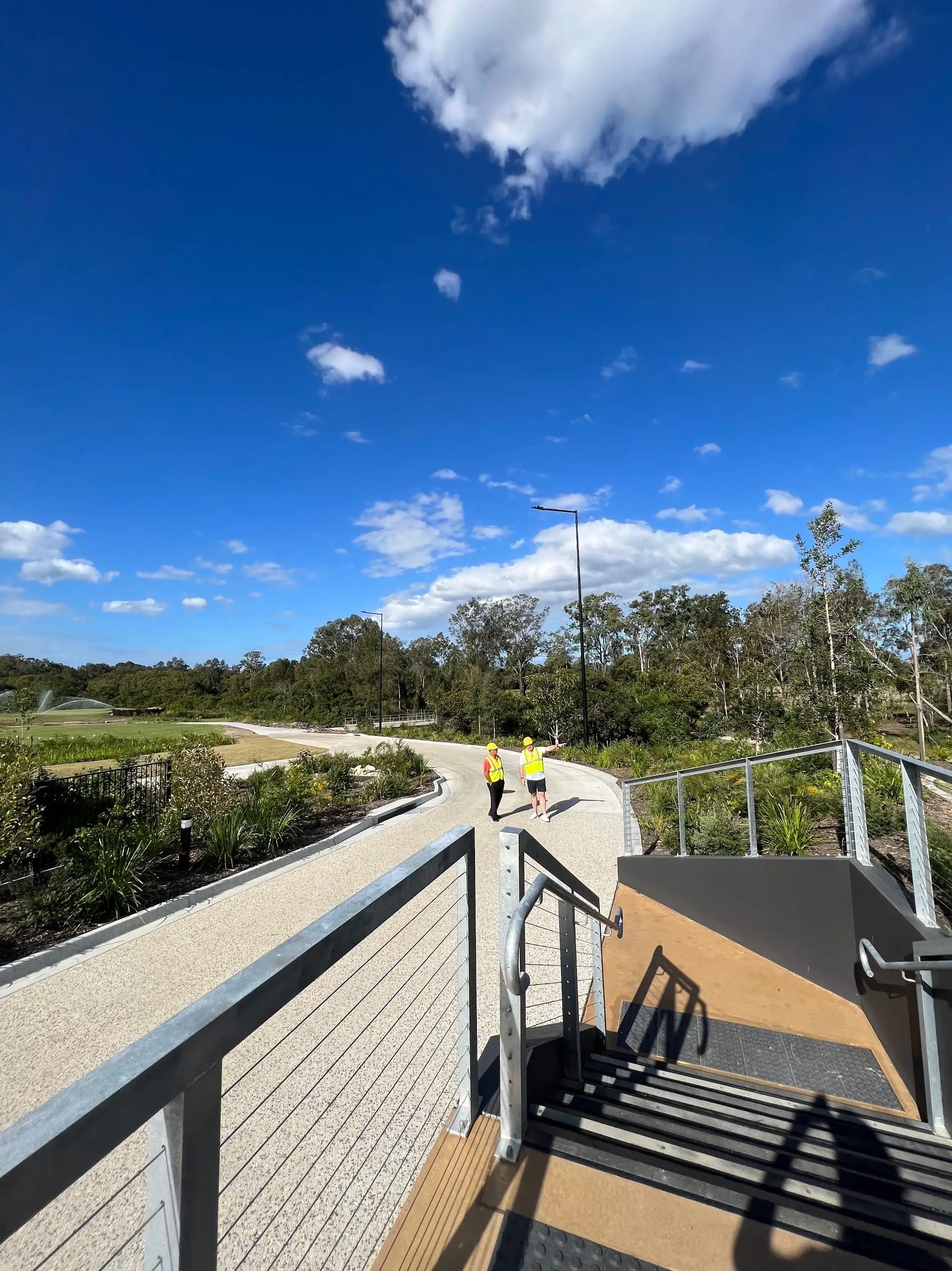 Boardwalk path through native bushland on the course