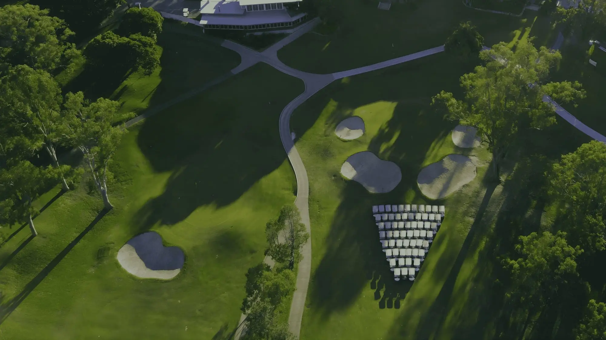 Aerial of bunkers and fairway with paths