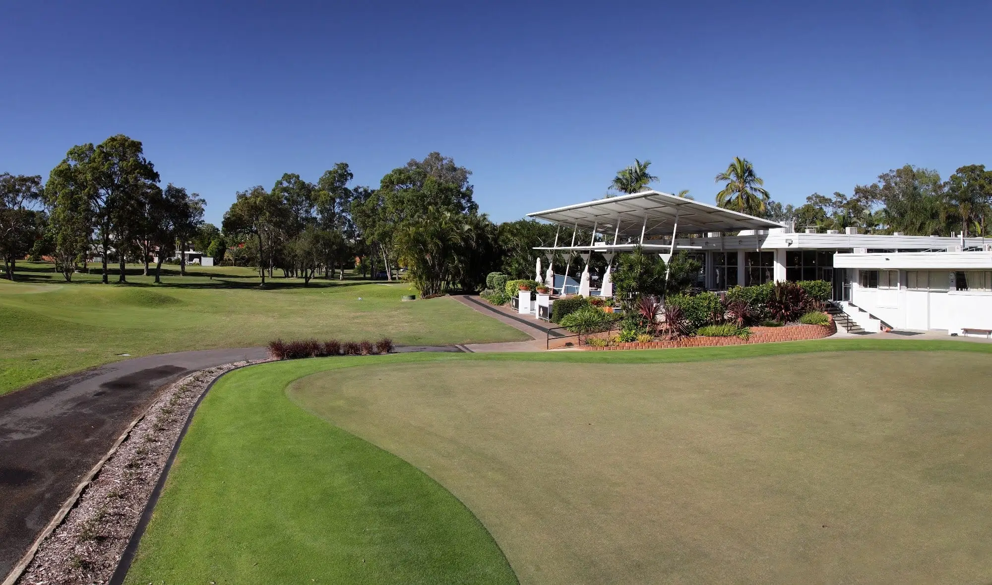 Clubhouse overlooking a green and fairway