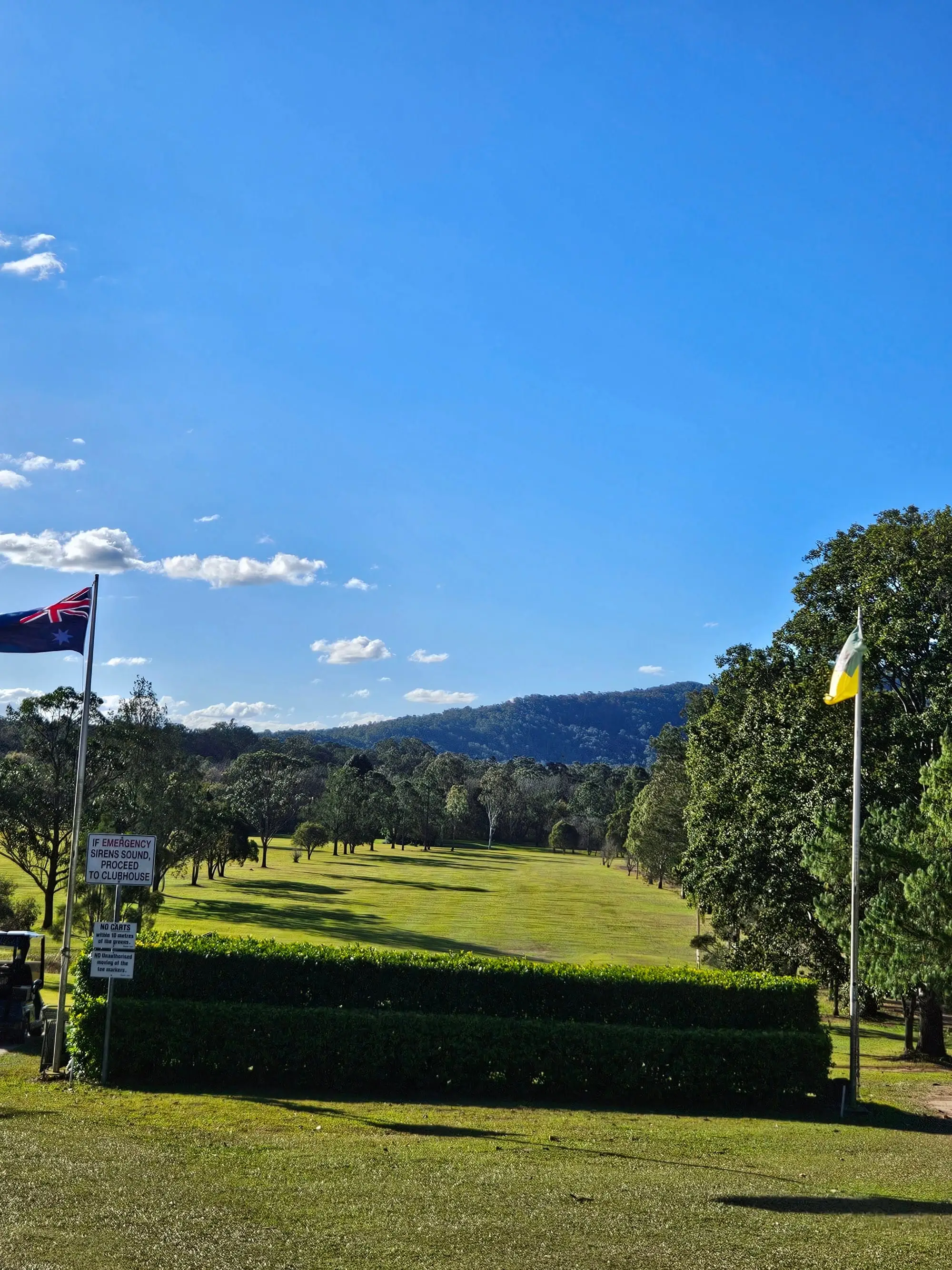Course in valley with flags and mountain views
