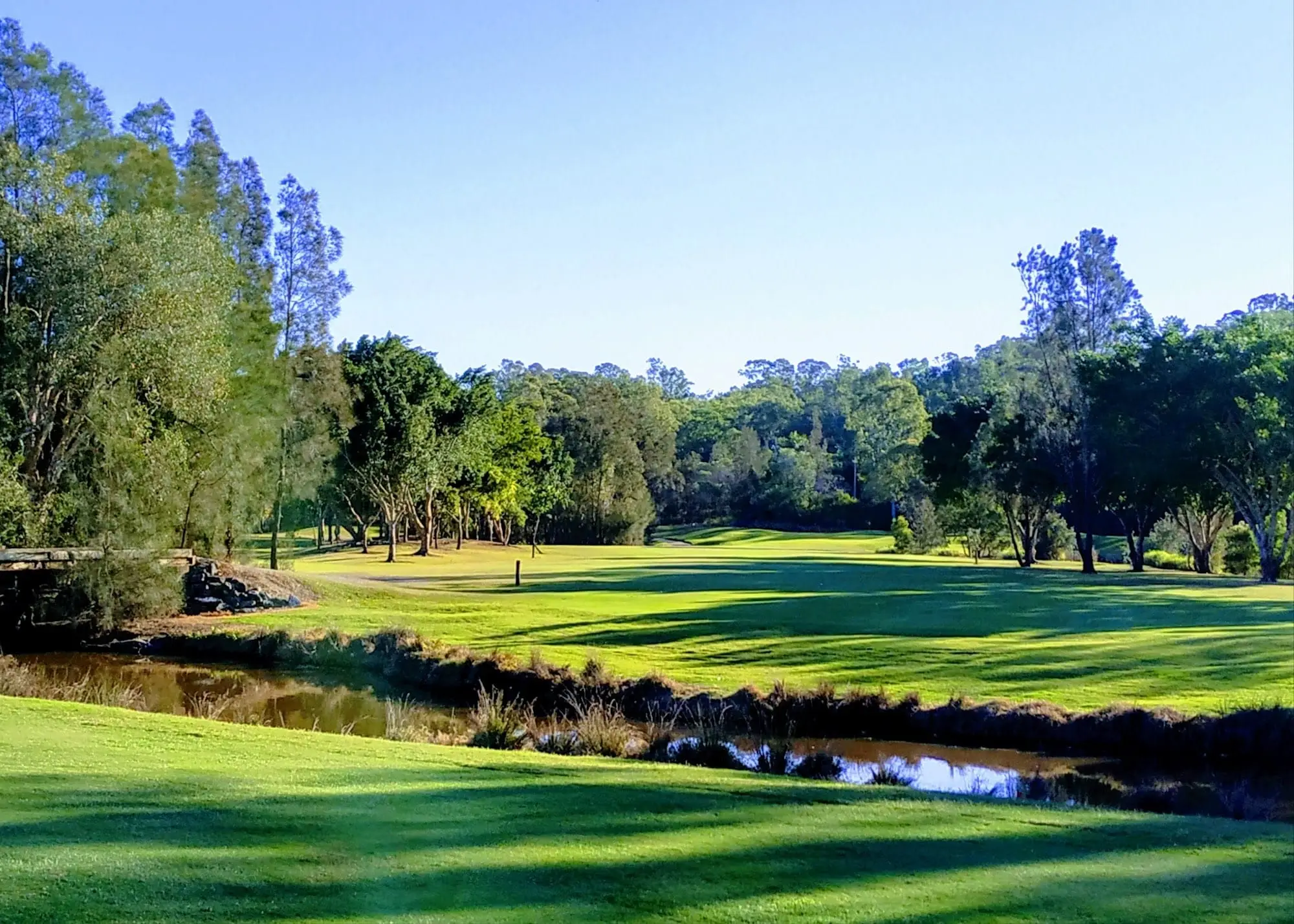 Fairway and creek in late afternoon sun
