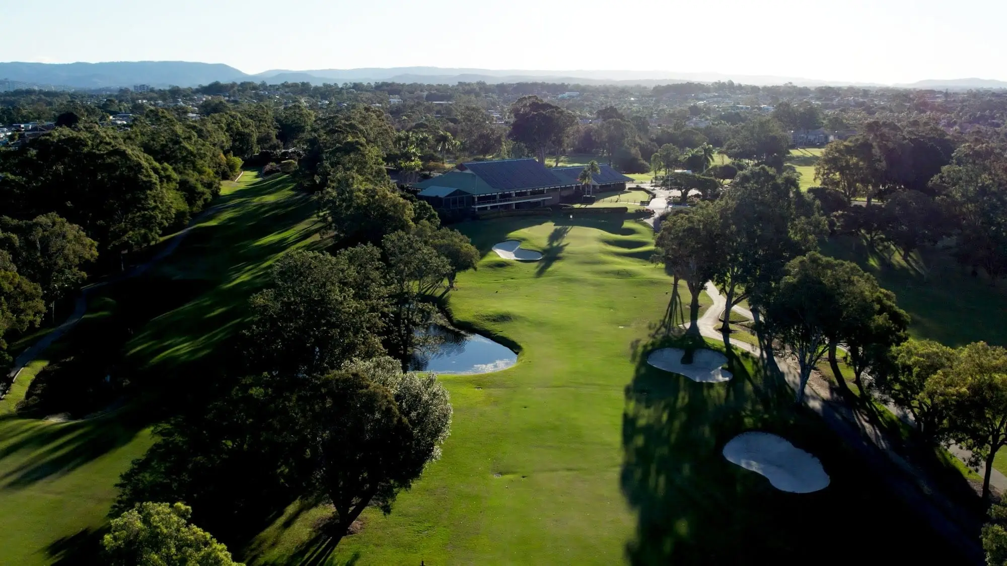 Aerial view of fairway and bunkers leading to the clubhouse