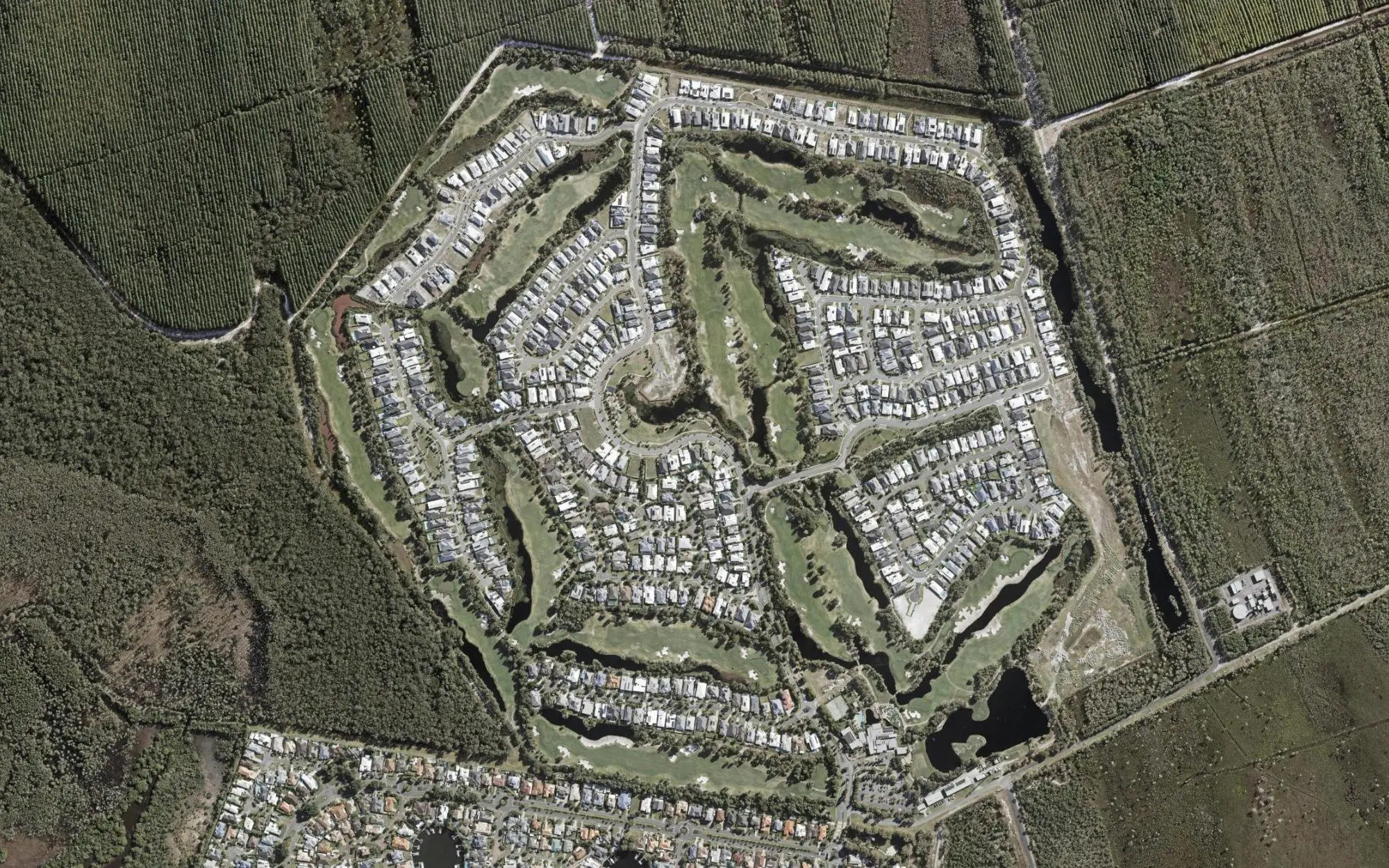 Aerial photo of Pacific Harbour Golf & Country Club with holes numbered at each tee